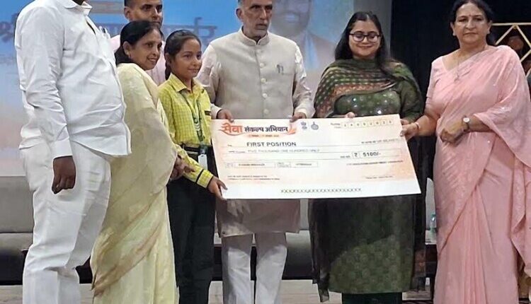 Kanika secures first place in district-level speech competition; honored by Union Minister.