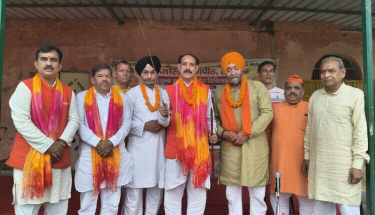 Grand conclusion of the yoga camp; Jaipal Shastri felicitated with the presentation of a sword.